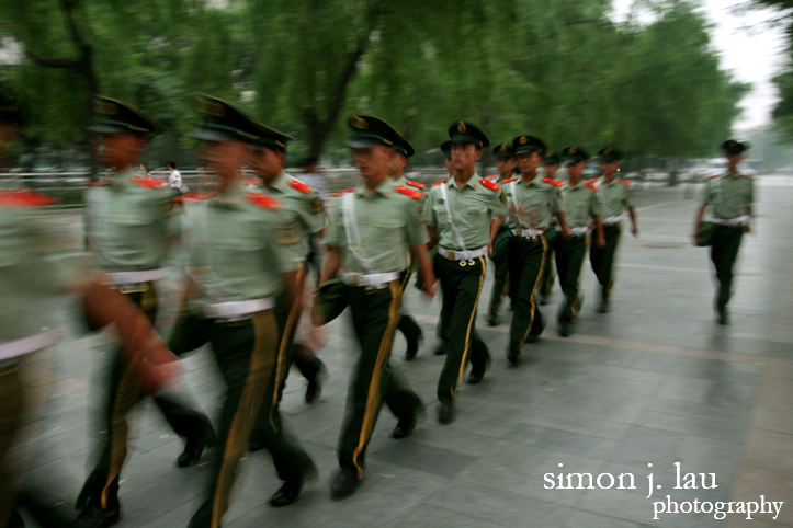 troops marching along tiananman square