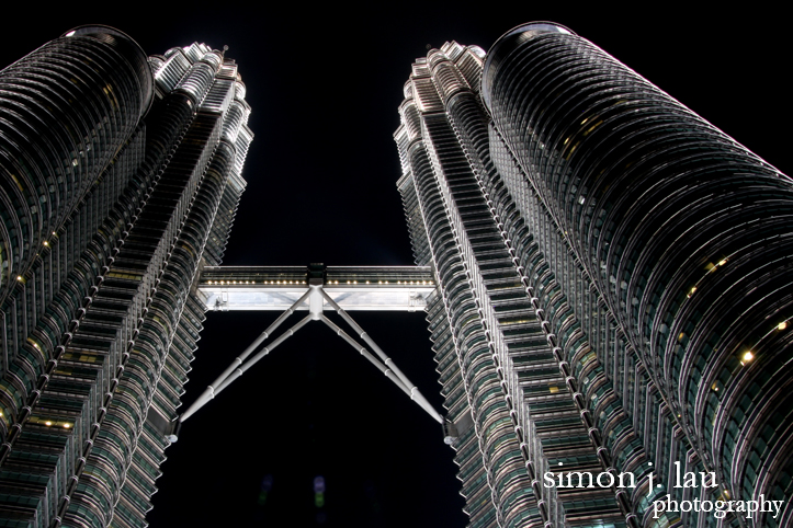 a photograph of the patronas twin towers in kuala lumpur